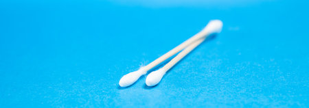 cotton swabs on a blue background
