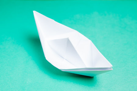 paper ship on blue backgroundの写真素材