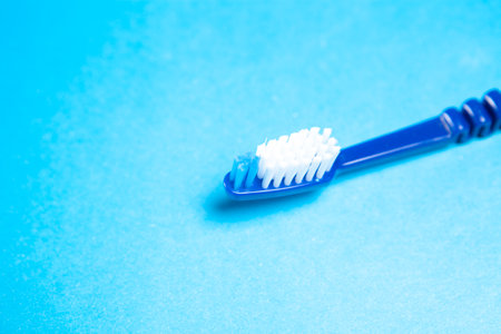 toothbrush on a blue backgroundの写真素材