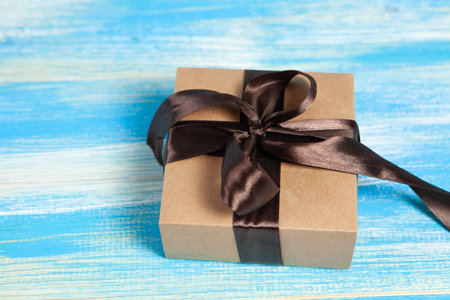 gift box on blue wooden backgroundの写真素材