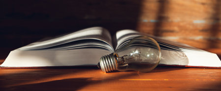 light bulb and book on the table. new ideasの写真素材