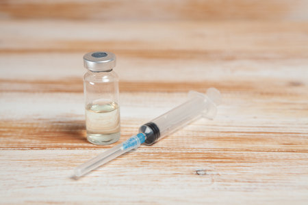 vial and syringe on the table. vaccination conceptの写真素材