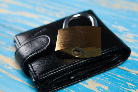 lock and black wallet on the table