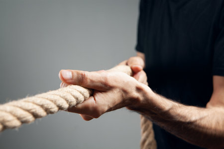 the man pulls the rope