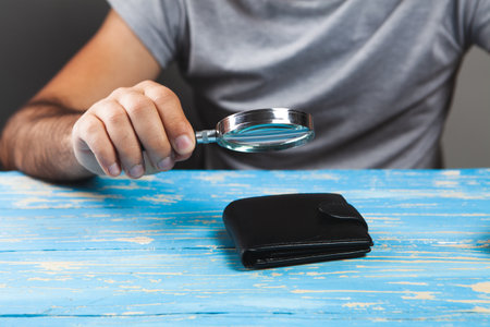 magnifying glass looks at the walletの写真素材