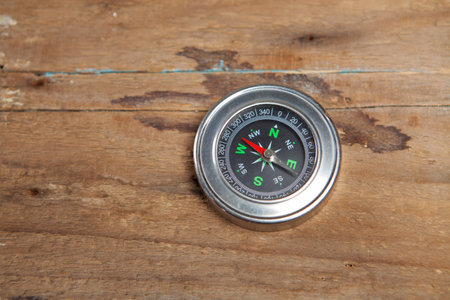 compass on a wooden table
