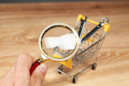 magnifier looks at the wrench in the basket. tool search conceptの写真素材