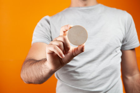 a man holding an empty white circleの写真素材