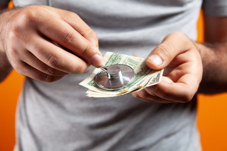 listening to a banknote with a stethoscopeの写真素材