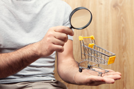 shopping search concept. magnifying glass looking at the basketの写真素材