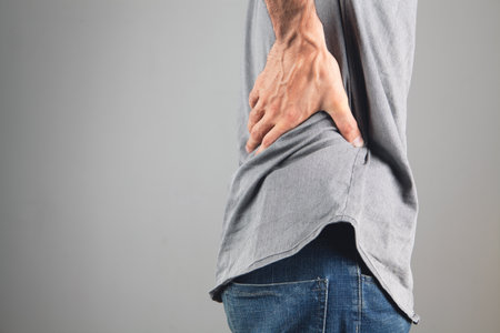 the man's back hurts. kidney pain
