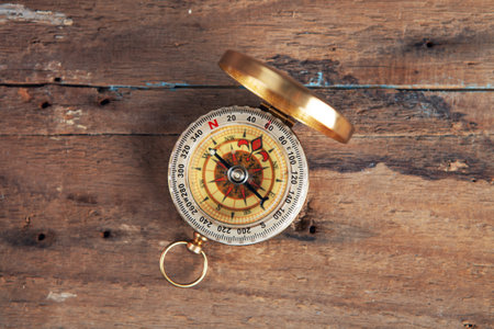 compass on a wooden tableの写真素材