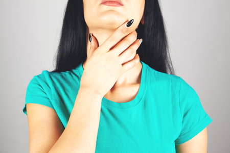the woman has a sore throatの写真素材