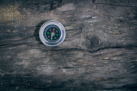 compass on an old wooden tableの写真素材