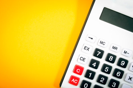 calculator on an orange background. concept counting