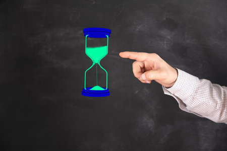 man clicks on virtual hourglass