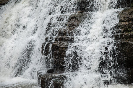 a small waterfall flows into the river