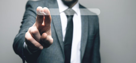 magnifier for web search. web search concept. the man presses the screenの写真素材