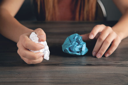 woman holding crumpled paper. concept ideaの写真素材