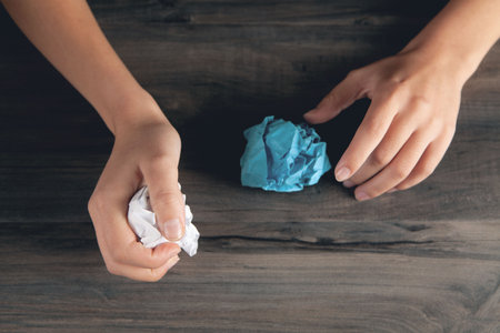 woman holding crumpled paper. concept ideaの写真素材