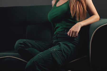 girl sitting on the couch posingの写真素材