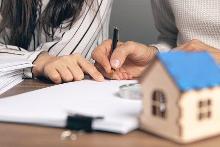 Man and woman discussing buying a houseの写真素材
