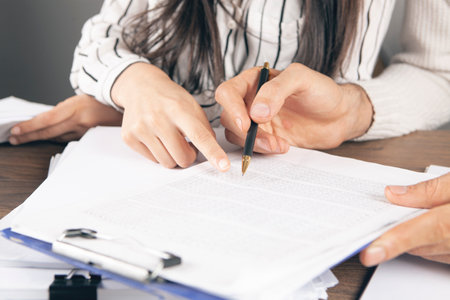 man and woman study papers
