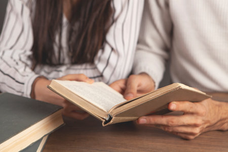 young couple reading a book