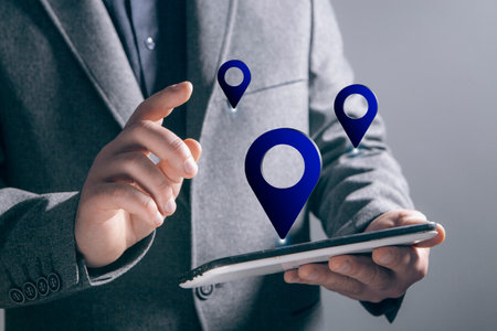 gps icon. man holding a phone in his hand