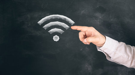 virtual icon of wifi from the network. man tapping on the screenの写真素材