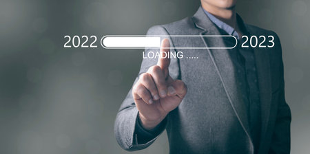 loading scale from year to year. from 2022 to 2023. man clicks on the screen