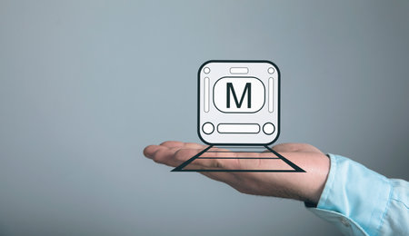 Subway icon on rails. Man holding in his handの写真素材