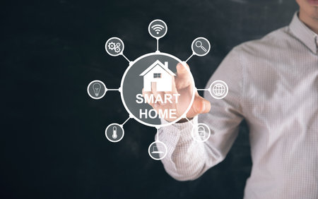 Illustrated smart home. Man tapping on the screenの写真素材