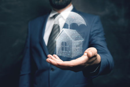 The house from the network is protected by an umbrella. The concept of virtual insurance. Man holding in his handの写真素材