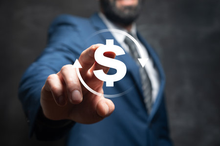 Dollar icon in a circle. Man tapping on the screenの写真素材