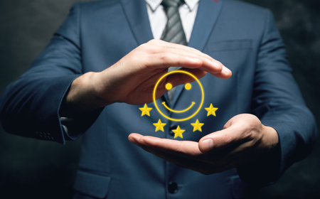 Cheerful emoticon and five stars. Businessman holding in his hand