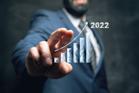 Growing chart 2022. Man tapping on the screenの写真素材