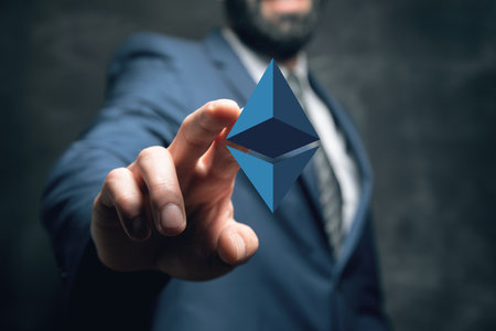 Cryptocurrency icon. Man tapping on the screenの写真素材