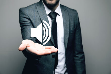 Sound on icon. Man holding in his handの写真素材