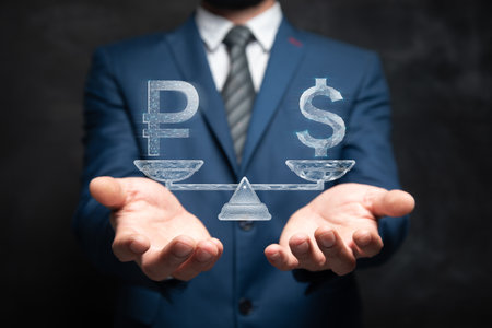 On the scales dollar and rubles from the network. Man holding in his handの写真素材