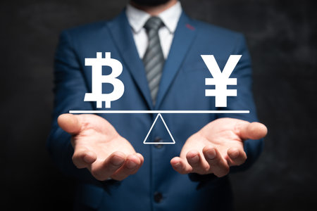 Bitcoin and yen on the scales. Man holding in his handの写真素材