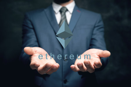 Ethereum virtual currency image. Cryptocurrency. Man holding in his handの写真素材