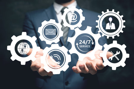 24/7 service icon in gears. Man holding in his handの写真素材