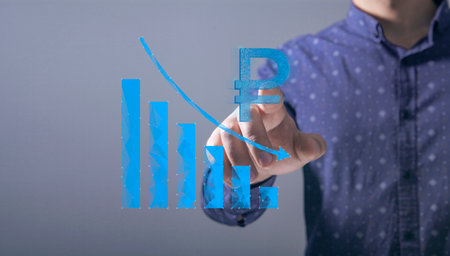 The concept of the fall of the ruble on the chart. Man tapping on the screenの写真素材