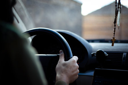 Man driving a car. Back view