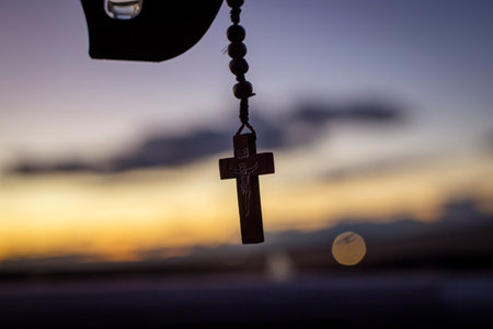 Christian Cross in the car. Against the backdrop of the skyの写真素材