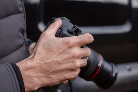 Photographer holding a camera in his hand