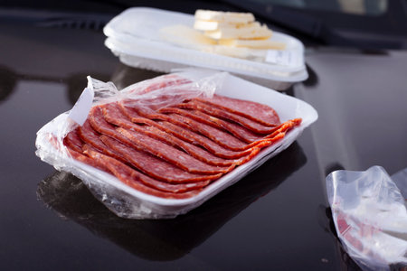 Lunch on the hood of a car during the day