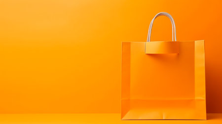 orange shopping bags on orange backgroundの素材