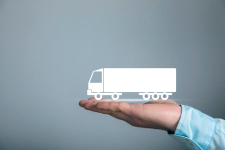 Man taps virtual screen. Truck icon on screenの写真素材